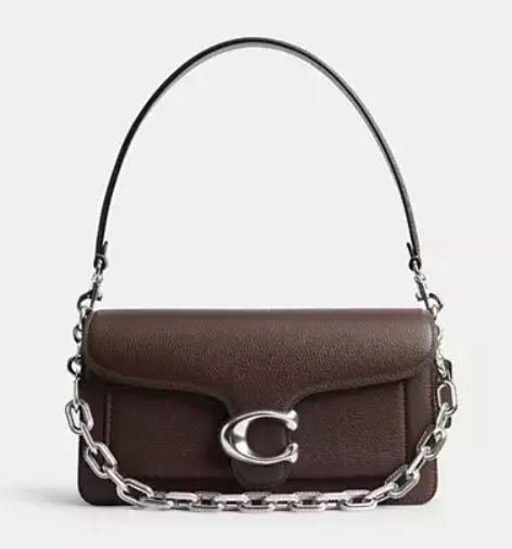 Brown handbag with a silver chain and closure, against a plain background.