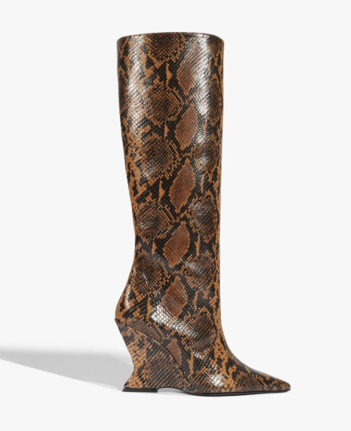 A knee-high boot with a snakeskin pattern and a pointed toe.