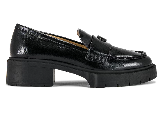 Black leather chunky-heeled loafer with a decorative buckle on the top.