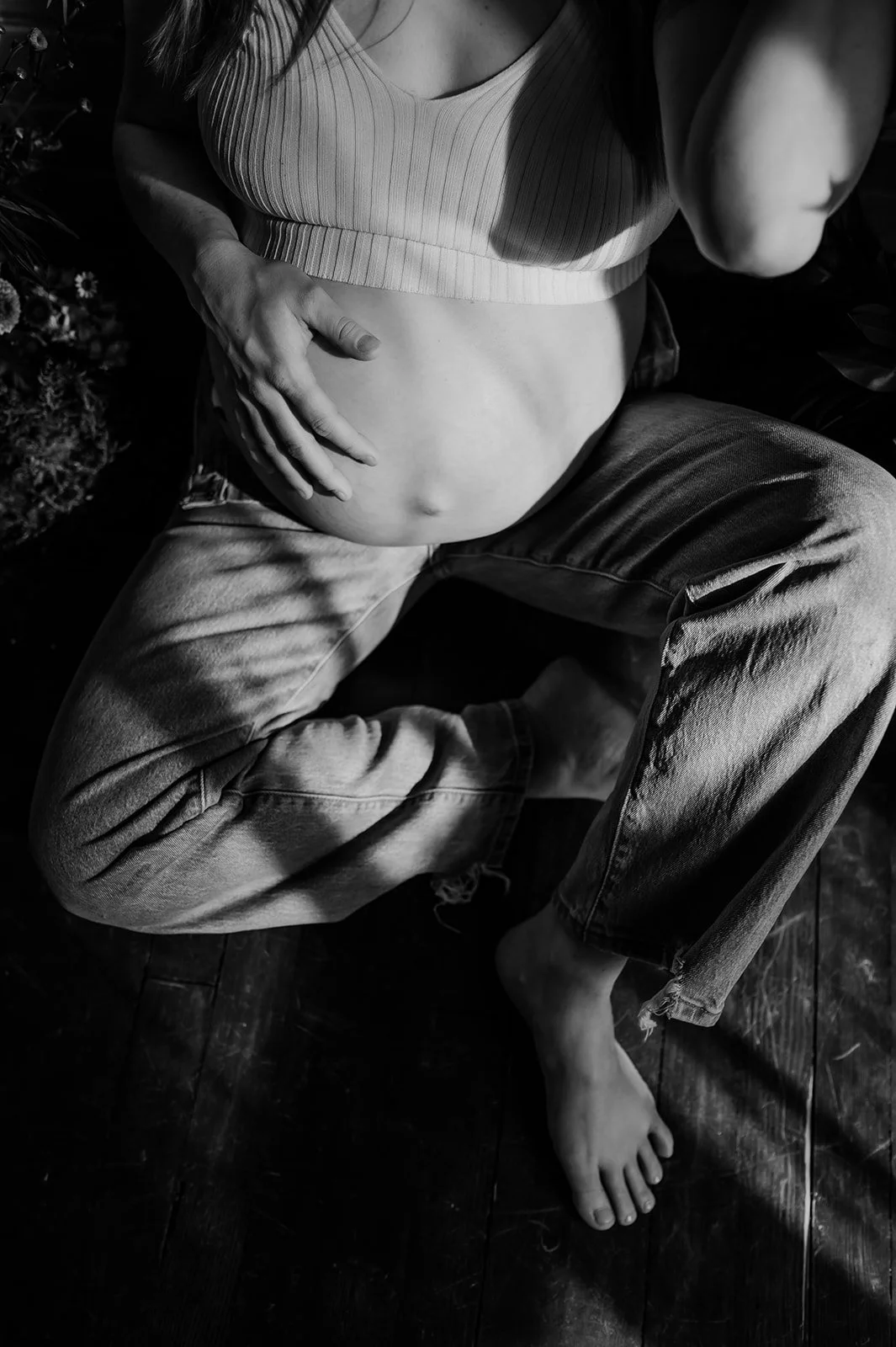 Photo of a pregnant belly being held by mother