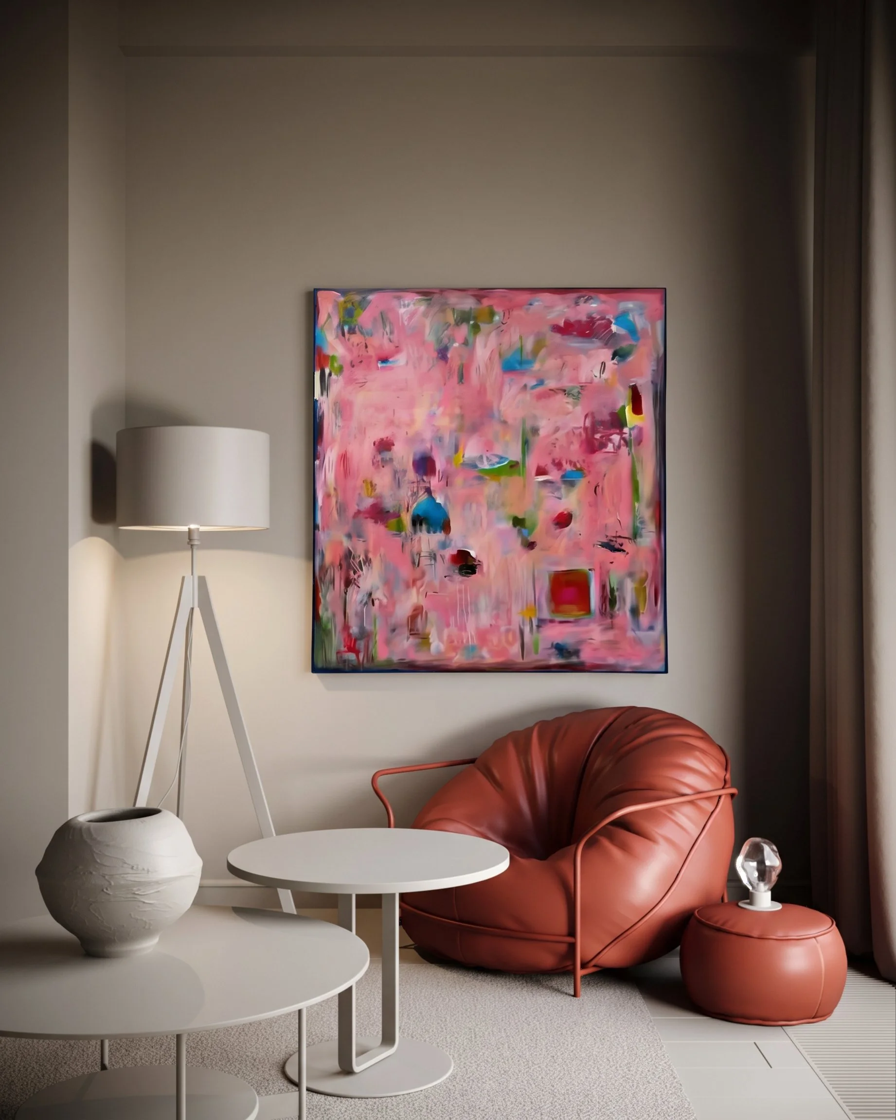 A room with a modern design. There is a white side table with a white vase near the foreground, a white tripod floor lamp on the left, and a pink leather armchair with a matching ottoman on the right. A large colorful abstract painting hangs on the beige wall behind the chair, and a beige carpet covers part of the floor.
