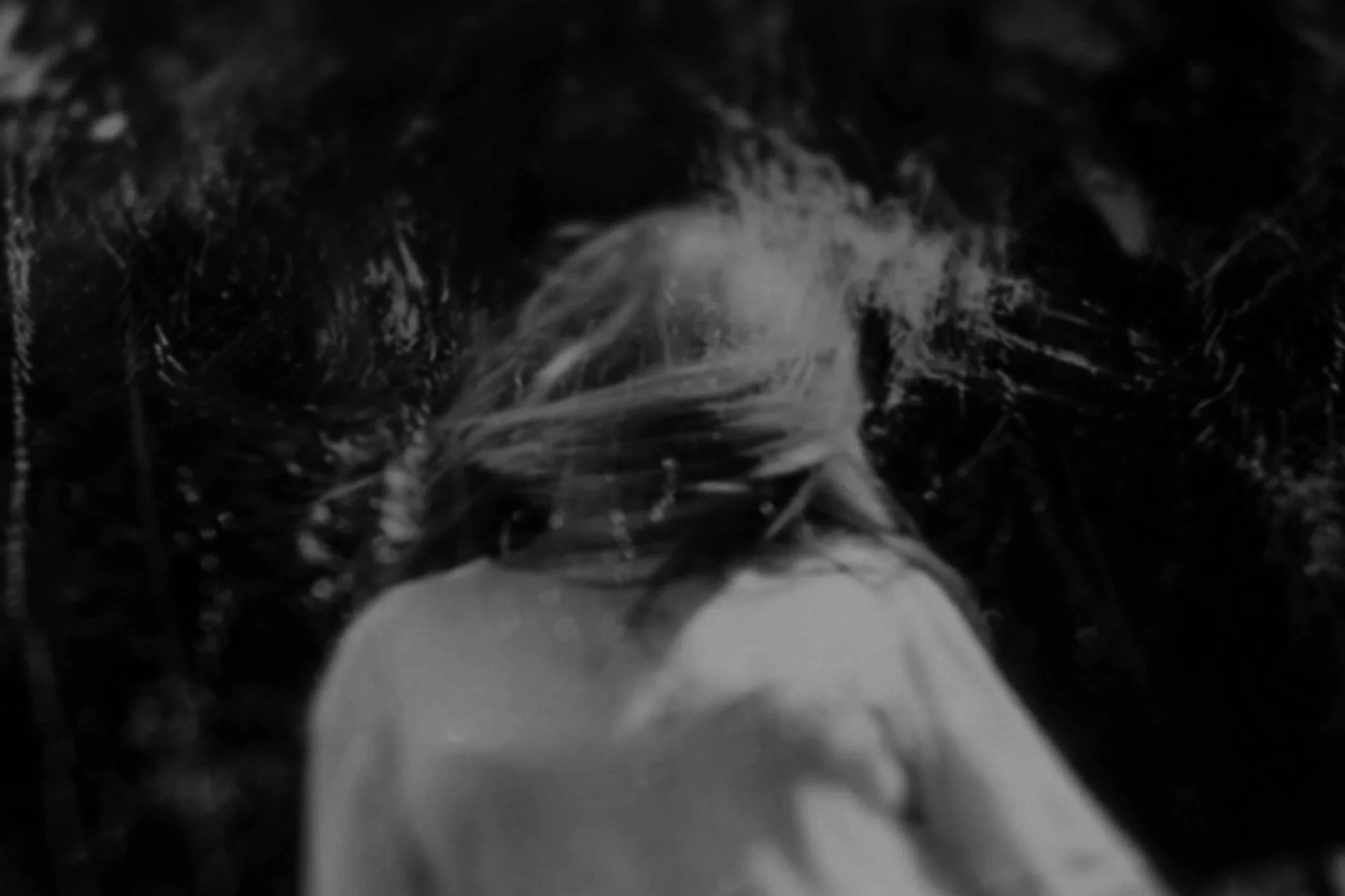 Dark and gritty image of woman in motion