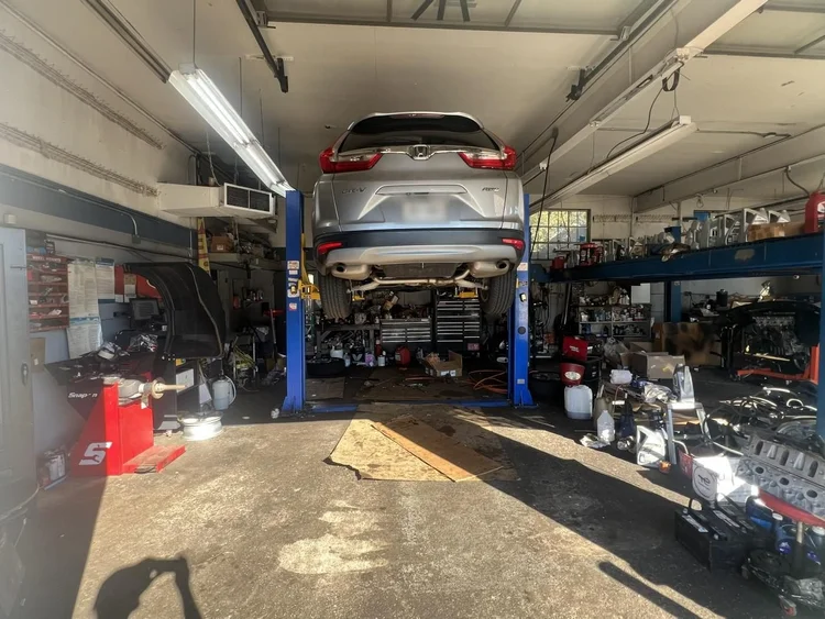Car on the lift in the RAFL Motors service bay, East Northport NY