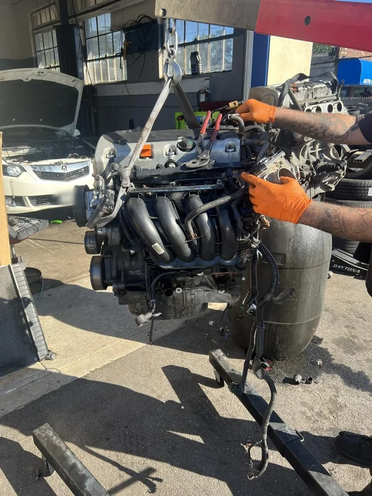 Mechanic working on an engine at RAFL Motors