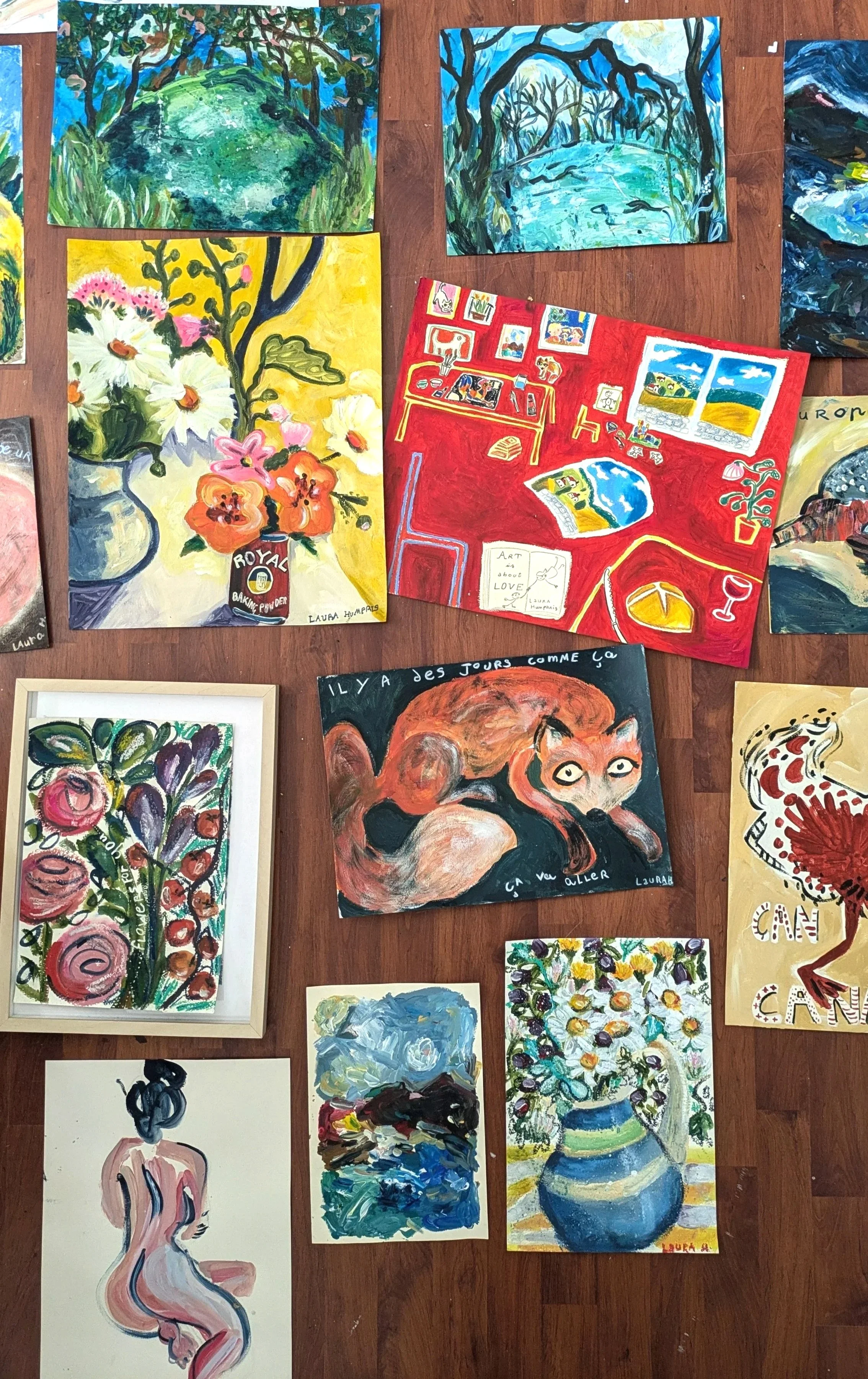 Collection of colorful paintings showcasing various styles. The artworks include abstract, floral, portrait, and landscape themes, painted with bold brushstrokes and vibrant colors.