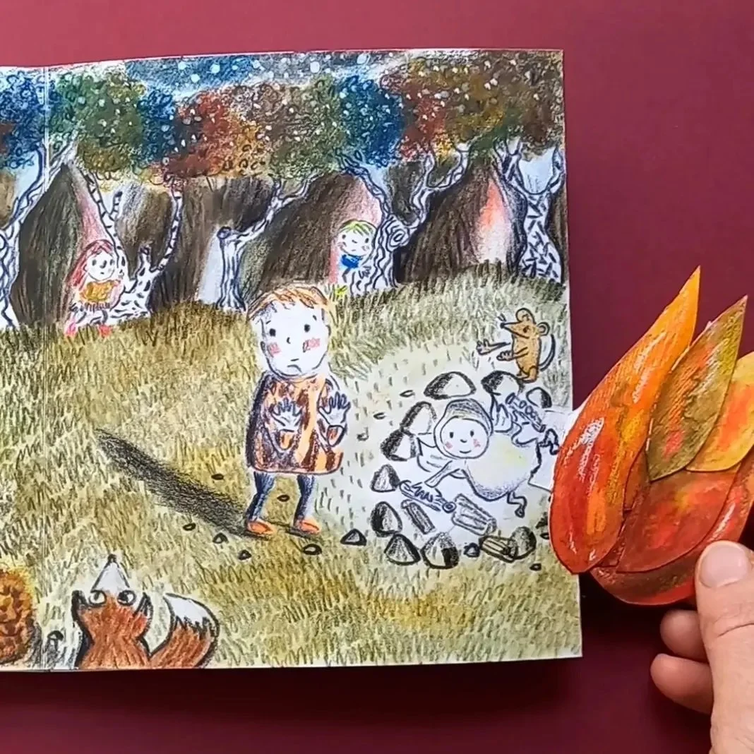 Colorful illustrated children’s storybook page showing kids and animals in a forest, with a 3D leaf craft attached to the right side.