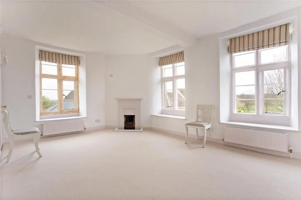 lowerfield-farm-bright-room-with-corner-fireplace.jpg