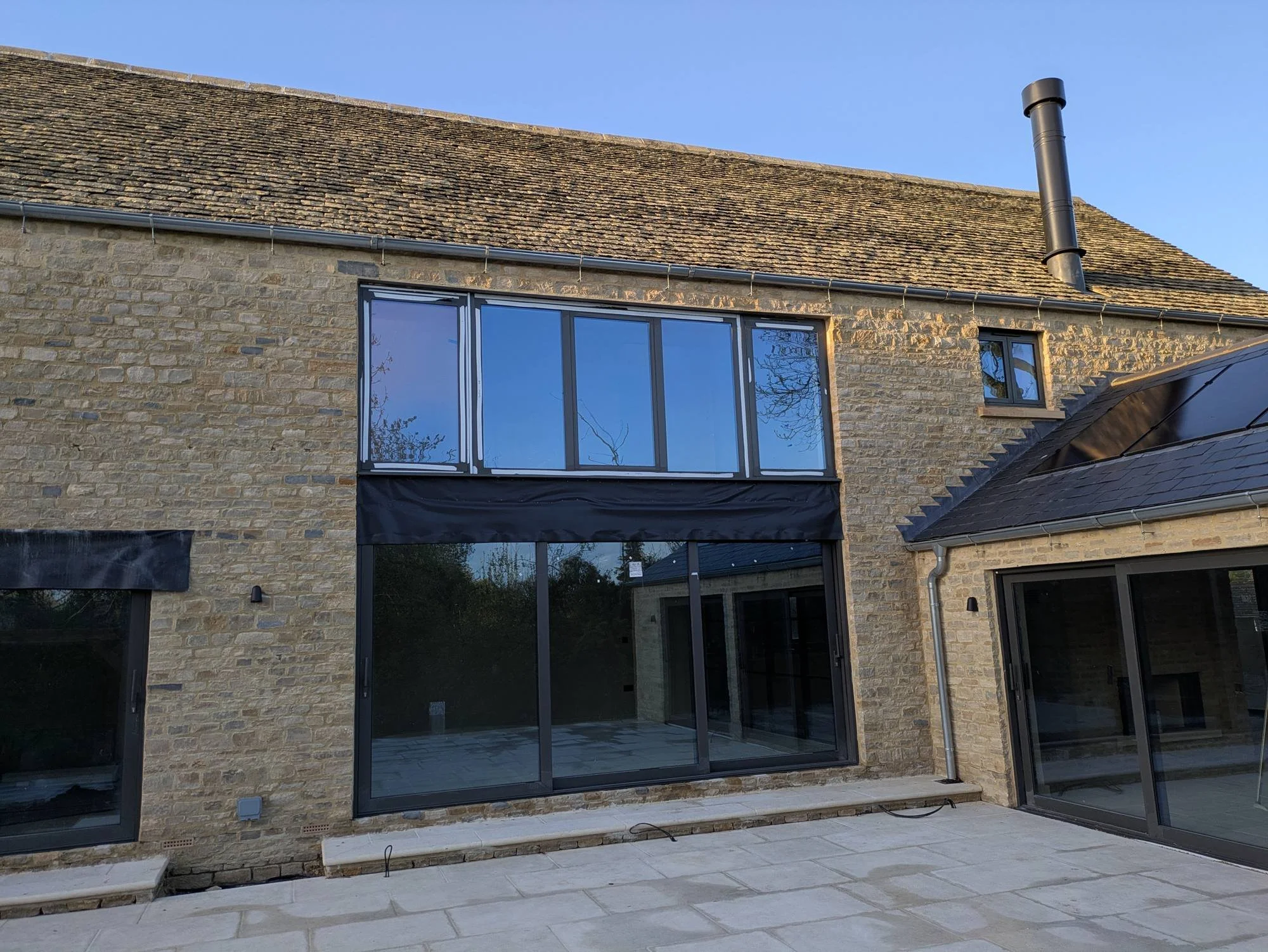 new-barn-rear-elevation-expansive-glazing-and-terrace.jpg