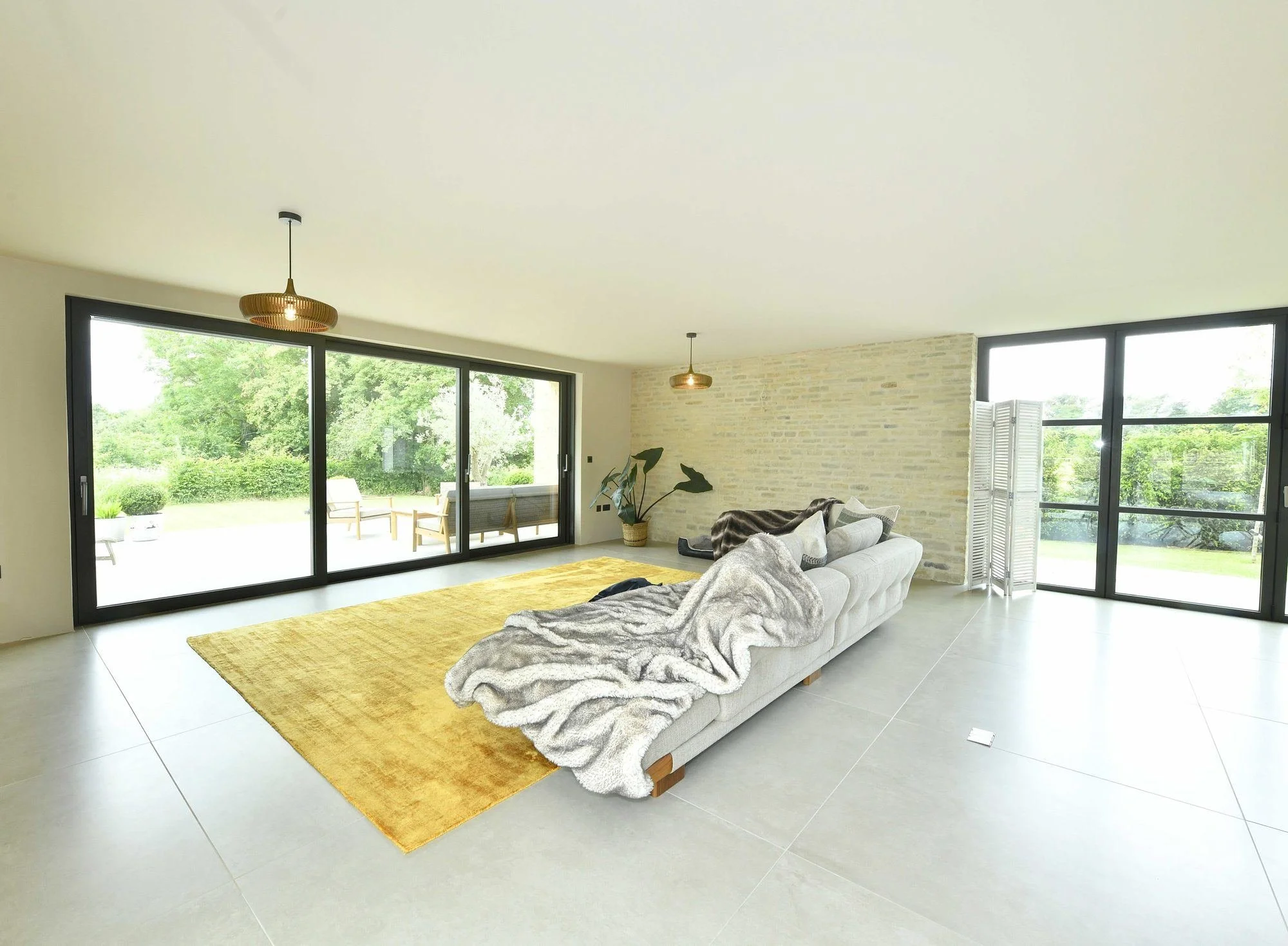 back-barn-living-area-exposed-stone-wall-sliding-doors.jpg