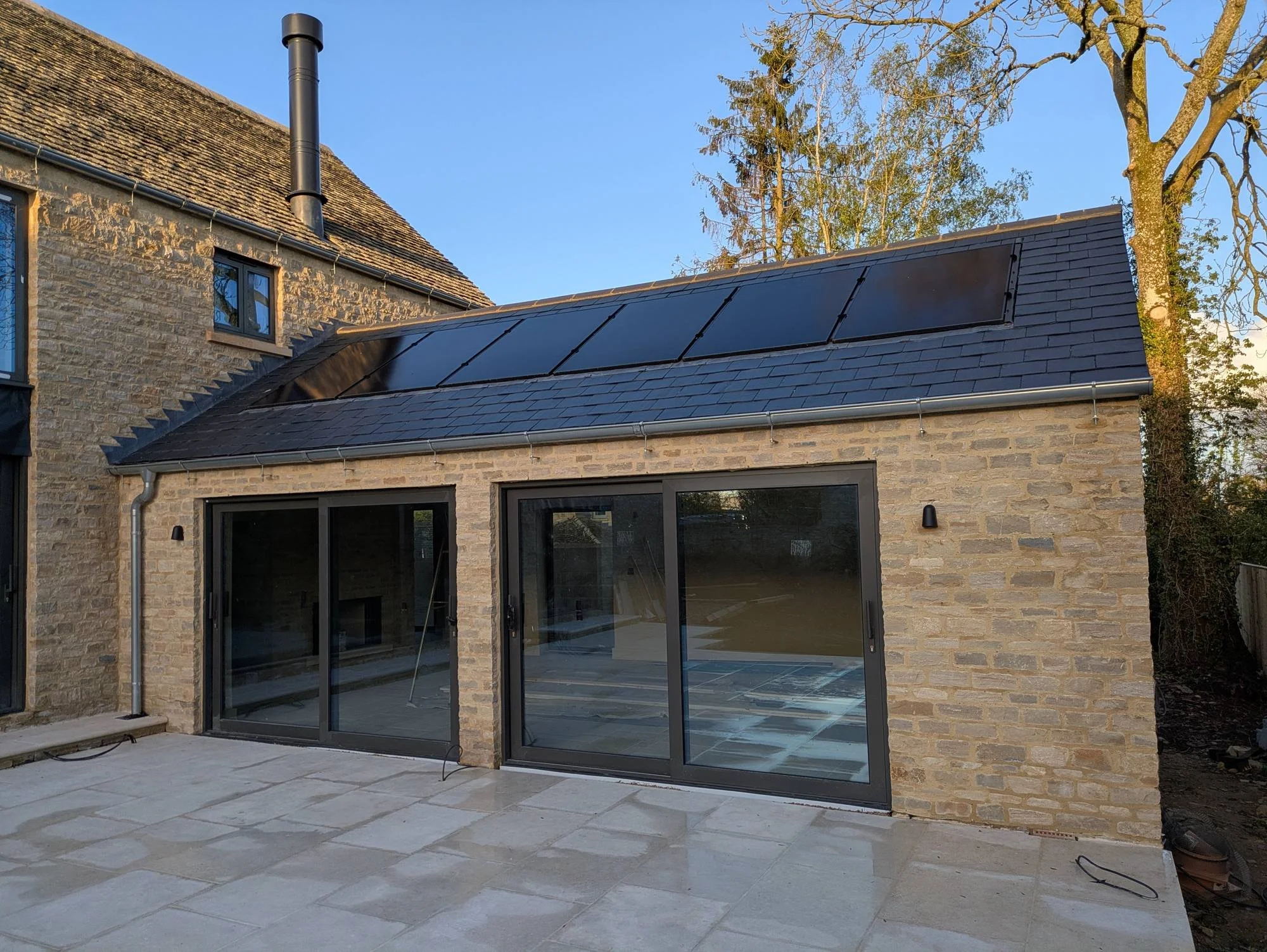 new-barn-single-storey-wing-sliding-doors-and-solar-panels.jpg