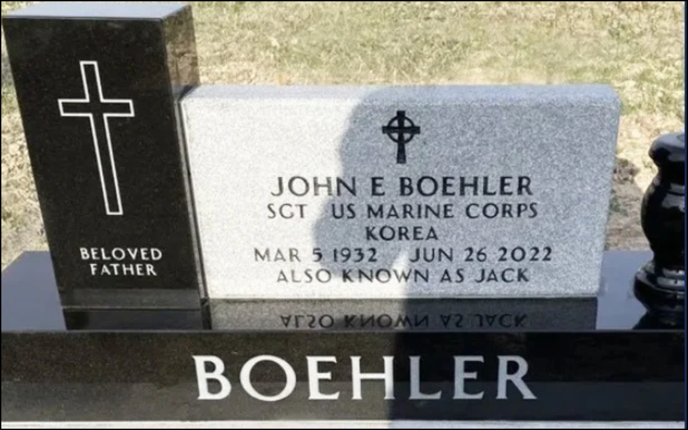 Gravestone for John E Boehler, a Marine Corps Sergeant from Korea, born on March 5, 1932, and died on June 26, 2022. The gravestone has a black cross and an inscription reading 'Beloved Father'.