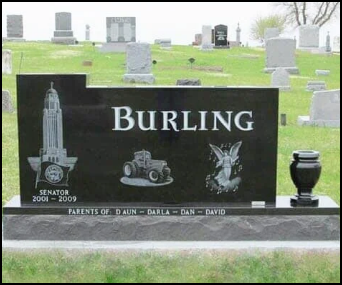 A gravestone in a cemetery for a person with the last name Burling, with images of a city skyline, a tractor, and a fairy. The gravestone indicates the person was a senator from 2001 to 2009 and mentions parents D'Aun, Darla, Dan, and David.