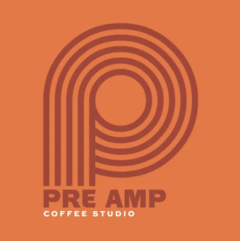 Logo for Pre Amp Coffee Studio with stylized letter 'P' in orange and brown colors