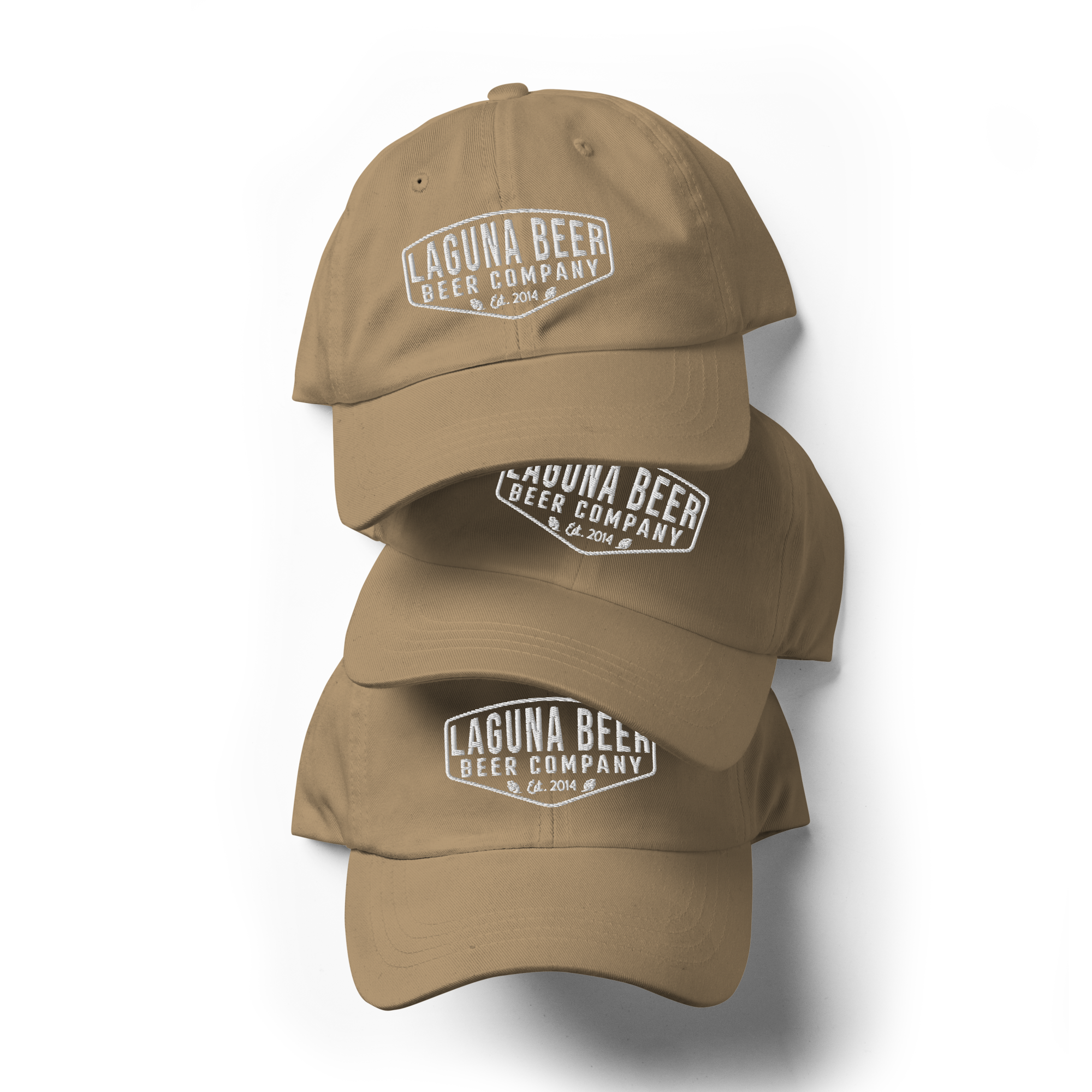 Four tan baseball caps with embroidered white text reading "LAGUNA BEER BEER COMPANY Est. 2014" on a black background.