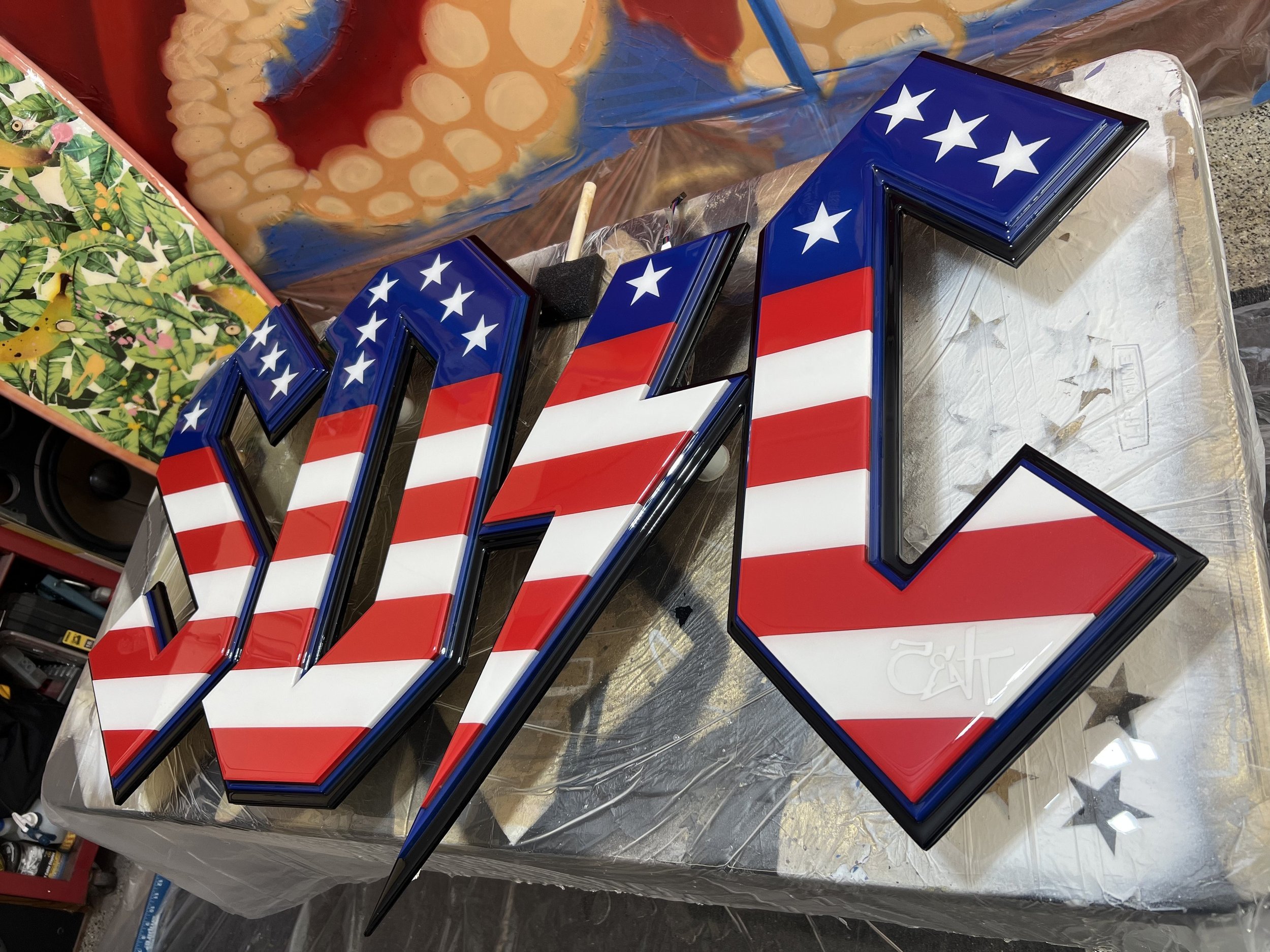 Decorative sign spelling out '2024' with an American flag pattern design.