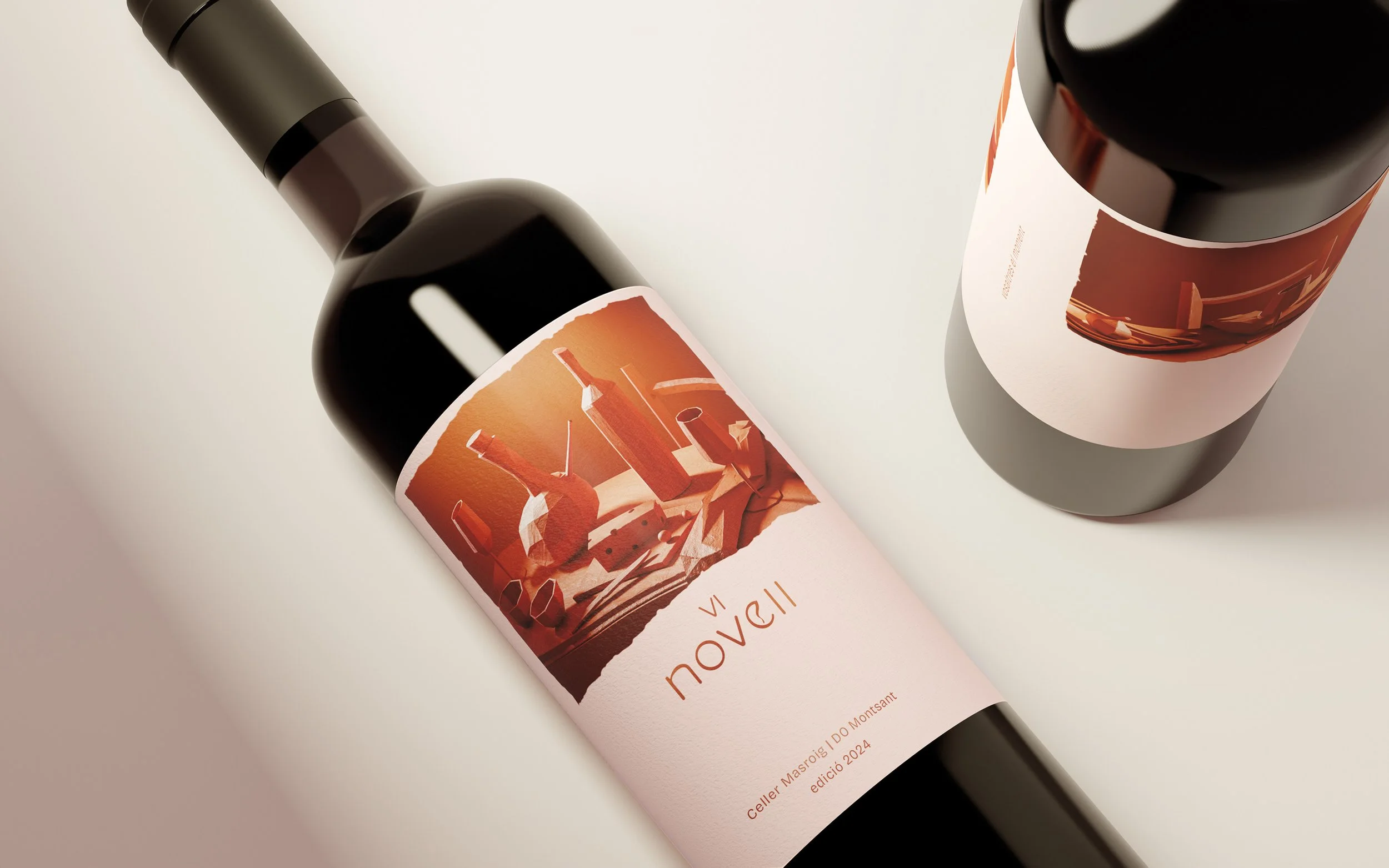 A bottle of wine with a pink label featuring an abstract orange and brown design, placed on a white surface.