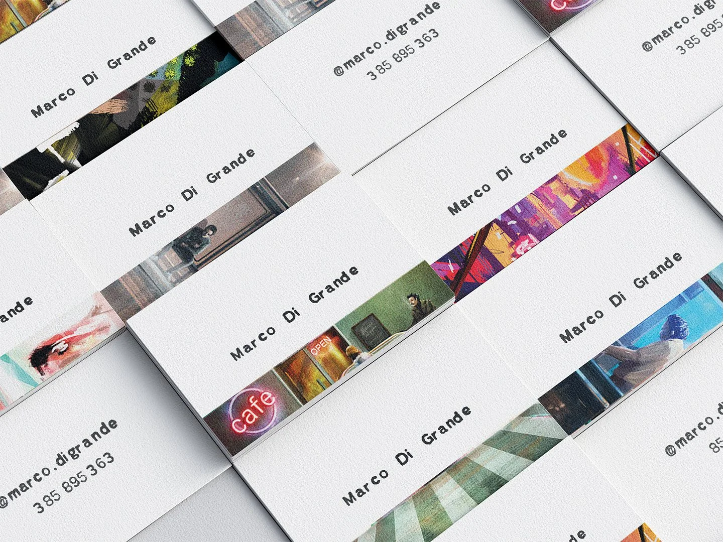 Multiple business cards for Marco Di Grande are arranged on a surface, displaying his contact information and various artwork or images on a white background.