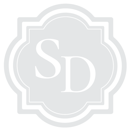 A logo with the letters 'S' and 'D' inside a decorative frame.