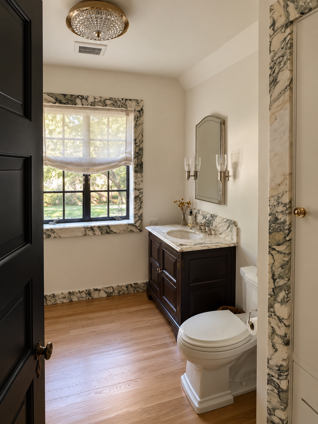 Elegant Marble-Trimmed Traditional Bathroom.png
