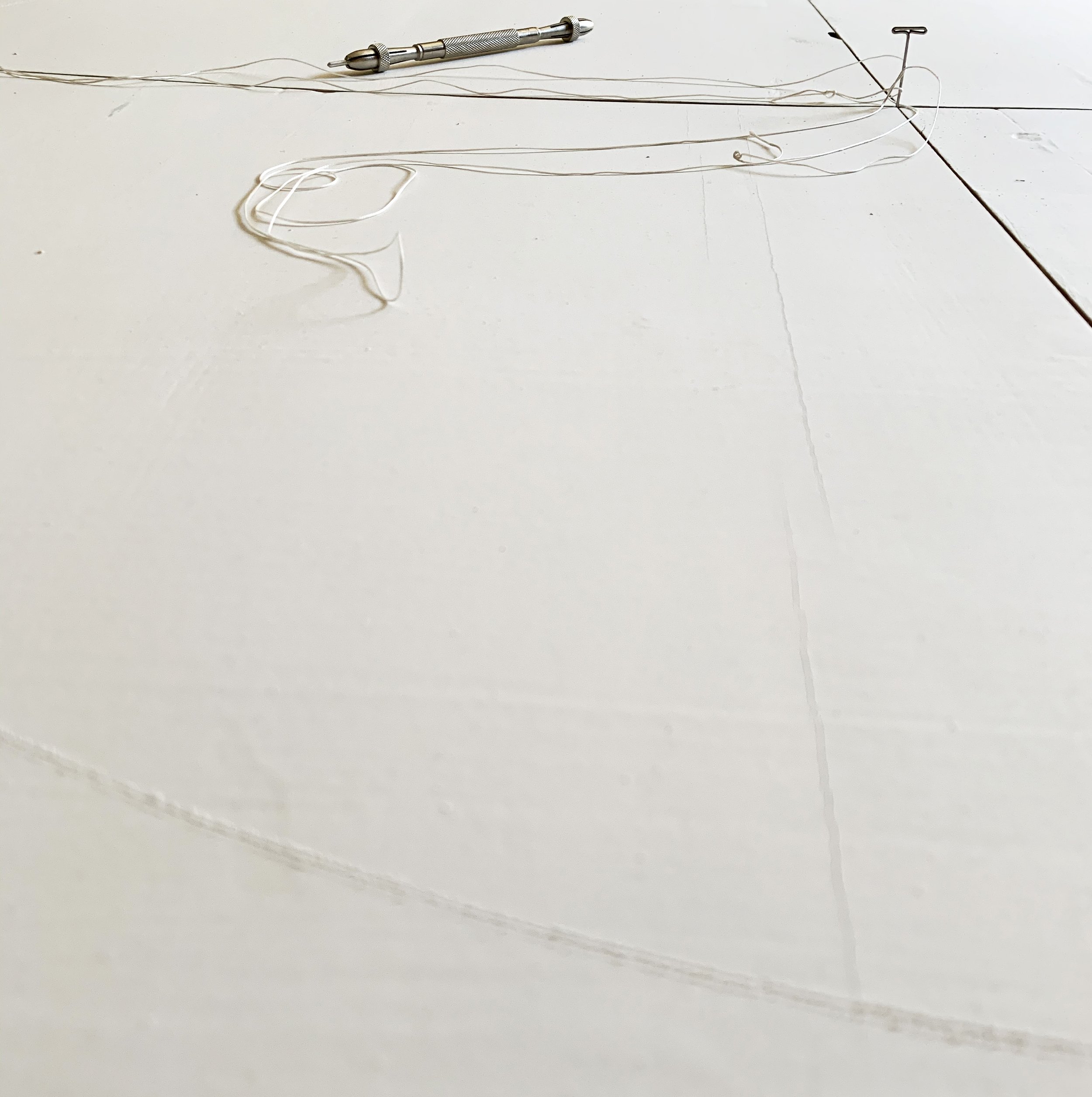 PLATE 2.64: Pin, string and silverpoint stylus used to inscribe the gesso with a circle, twice.