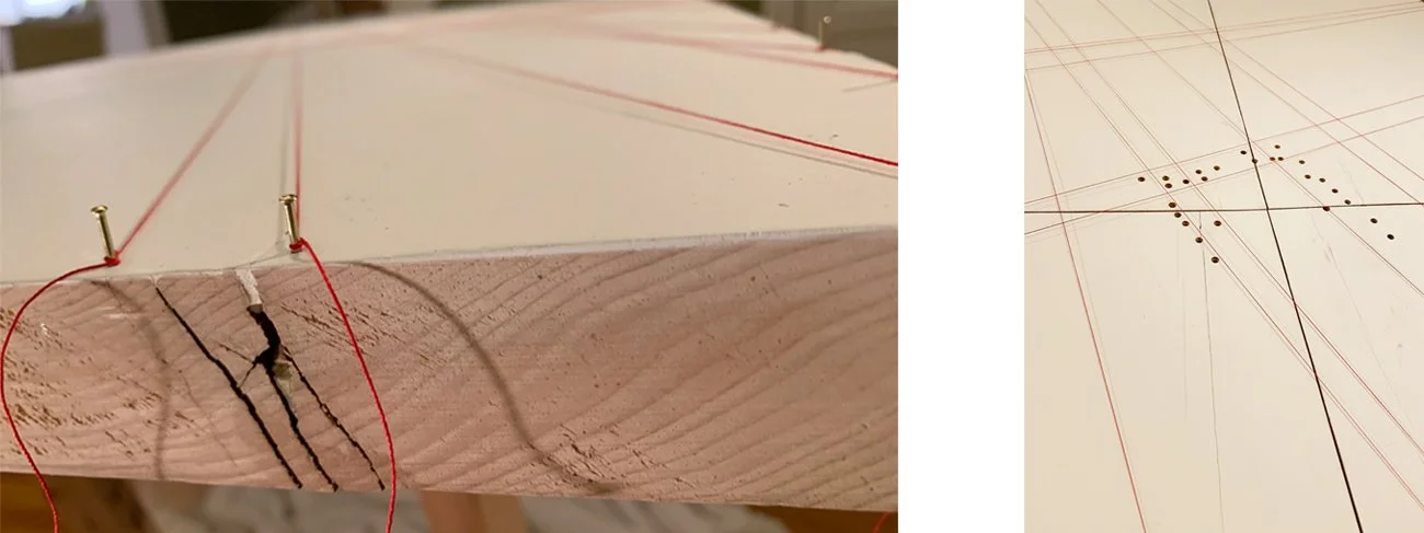 PLATE 2.58: Using pins at the edge of the table, I stretch red string across the surface to delineate areas in the building plan where I will apply fragrances. The strings do not touch or mark the white surface, and are removed once the process is co