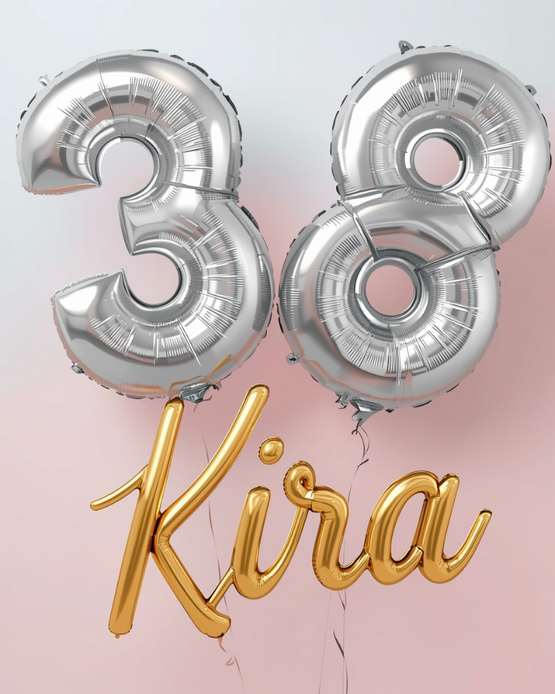 Silver foil balloons form the number 38, with a gold balloon spelling out the name 'Kira' below, against a pink background.