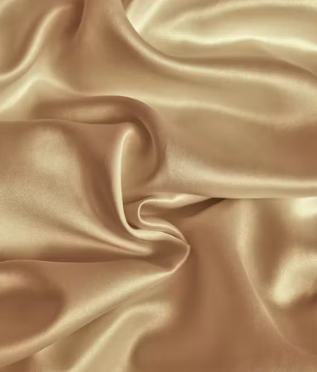 Golden satin fabric with gentle folds and sheen.