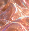 Shiny, peach-colored fabric with a smooth, reflective surface.