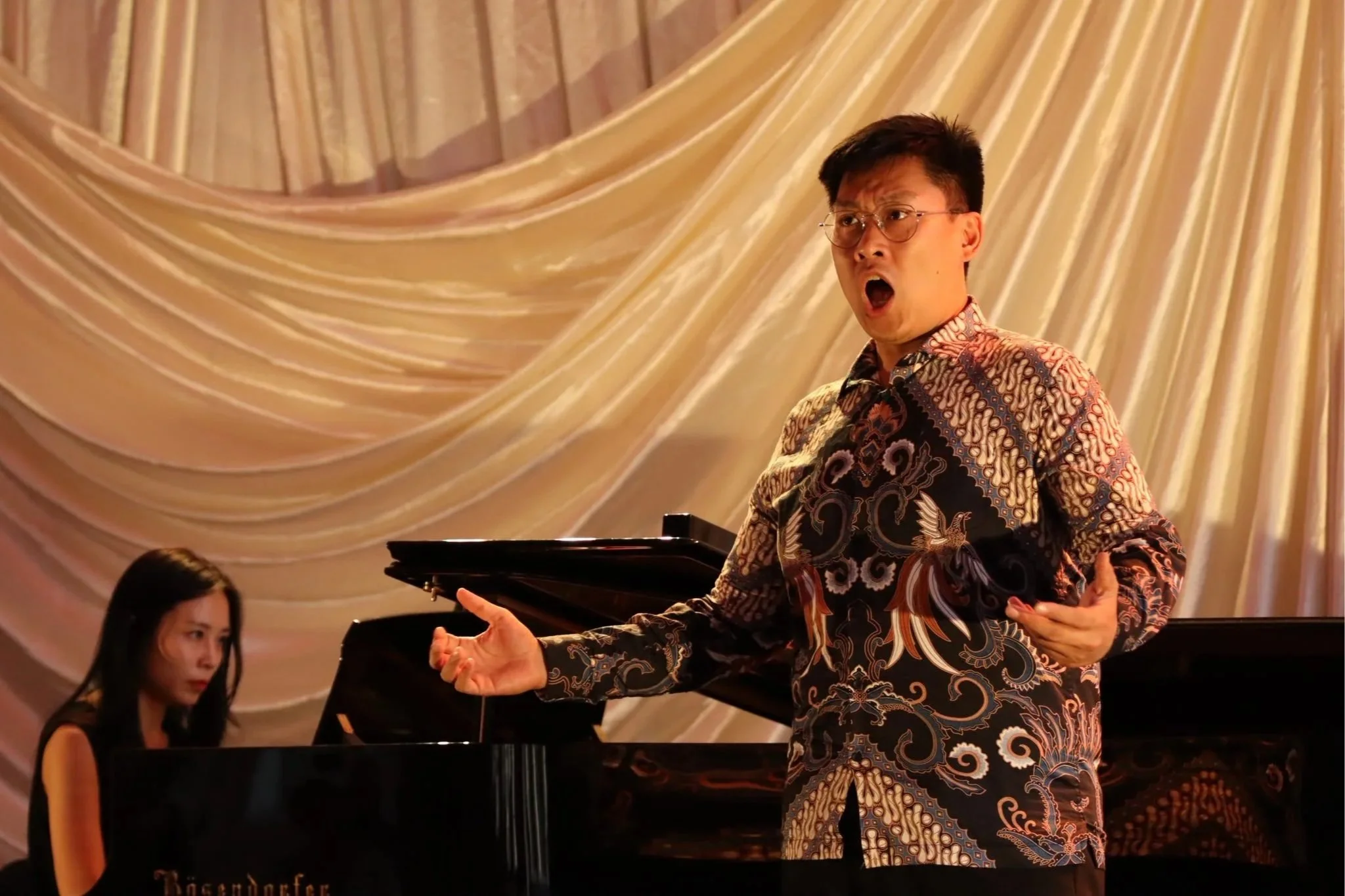 William Prasetyo singing in recital with piano