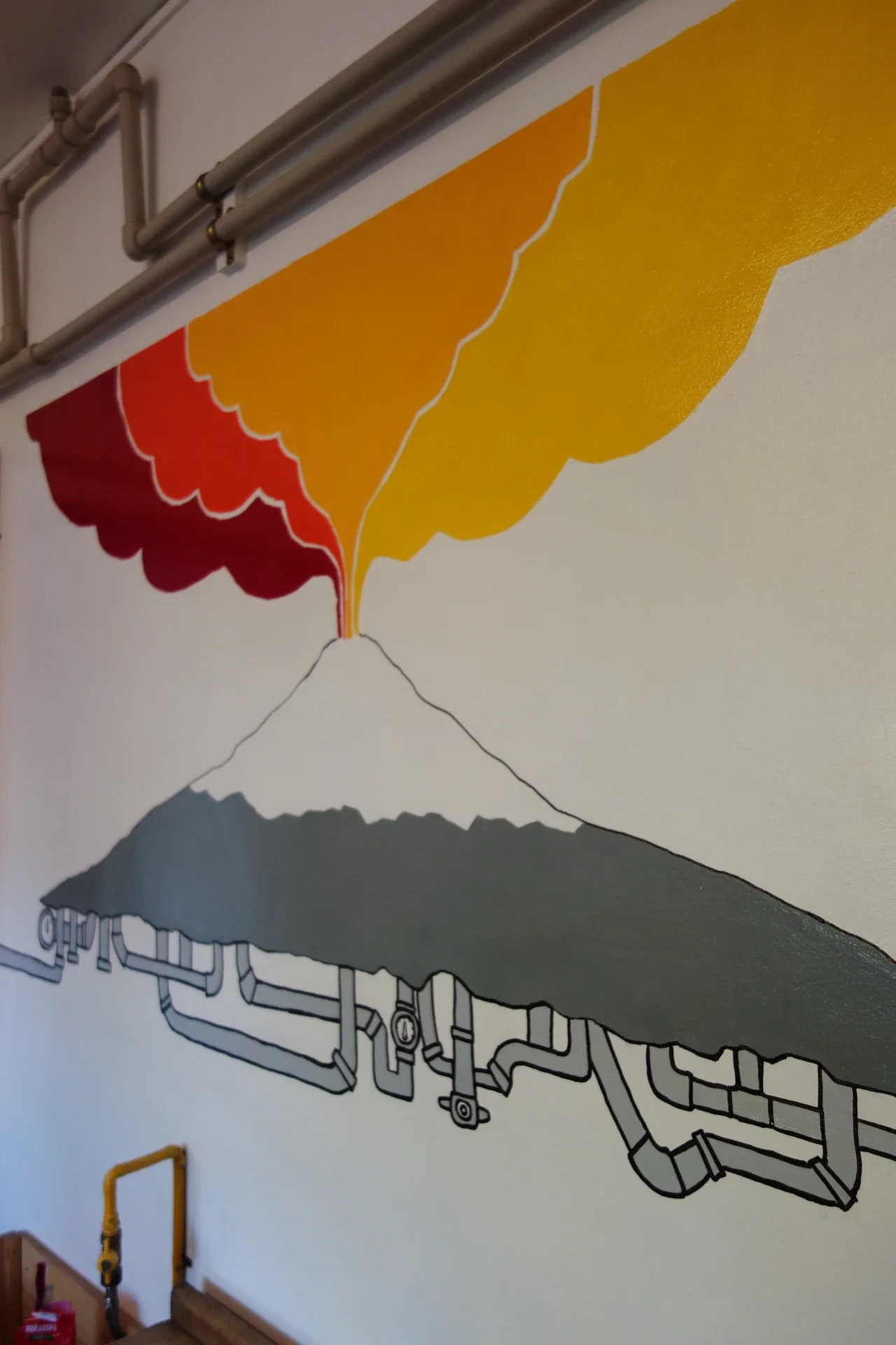 Kitchen wall mural featuring Villarrica Volcano at Chili Kiwi Hostel, Pucón, Chile.