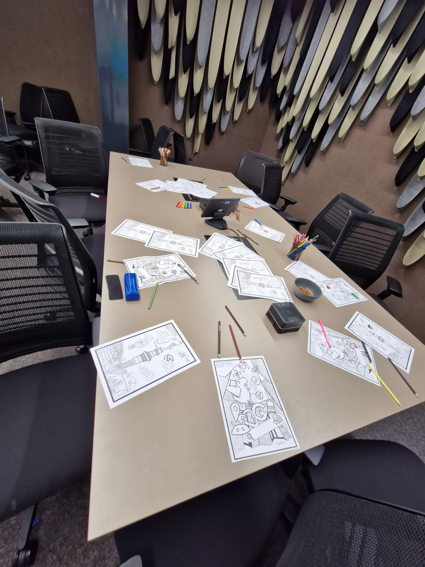 Workplace activity setup featuring printed custom colouring sheets and marker packs for Google NZ event attendees.