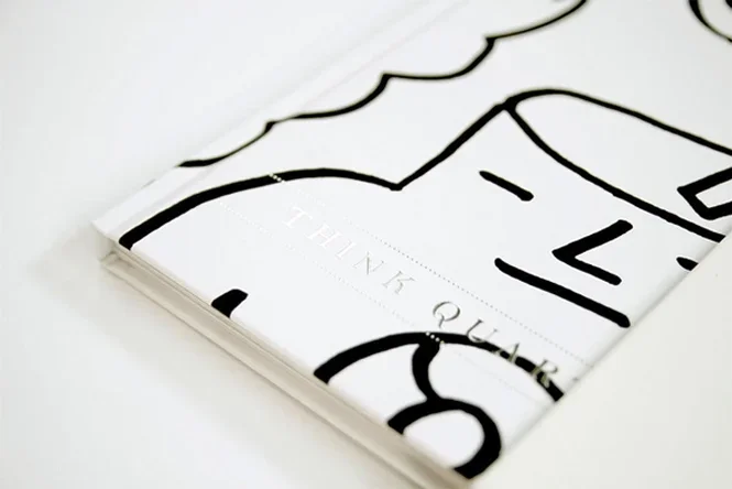 Close-up of custom line-art cover illustration featuring bold graphic character design.