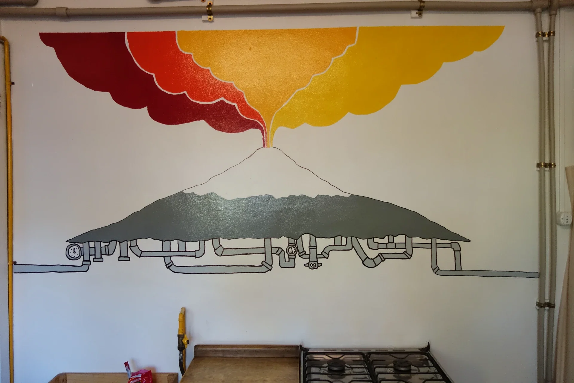 Integration of existing kitchen pipework directly into the volcanic smoke illustration.
