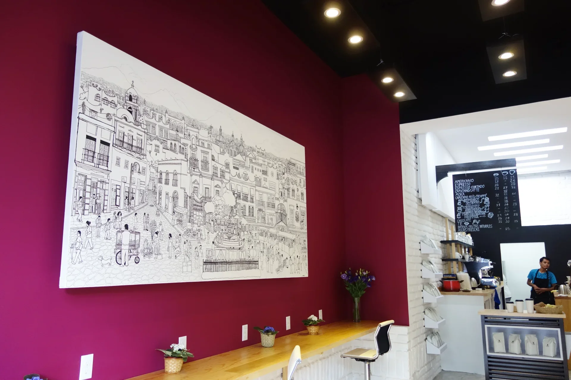 Large-scale hand-drawn canvas installation mounted above seating in Borola Cafe, San Ángel.