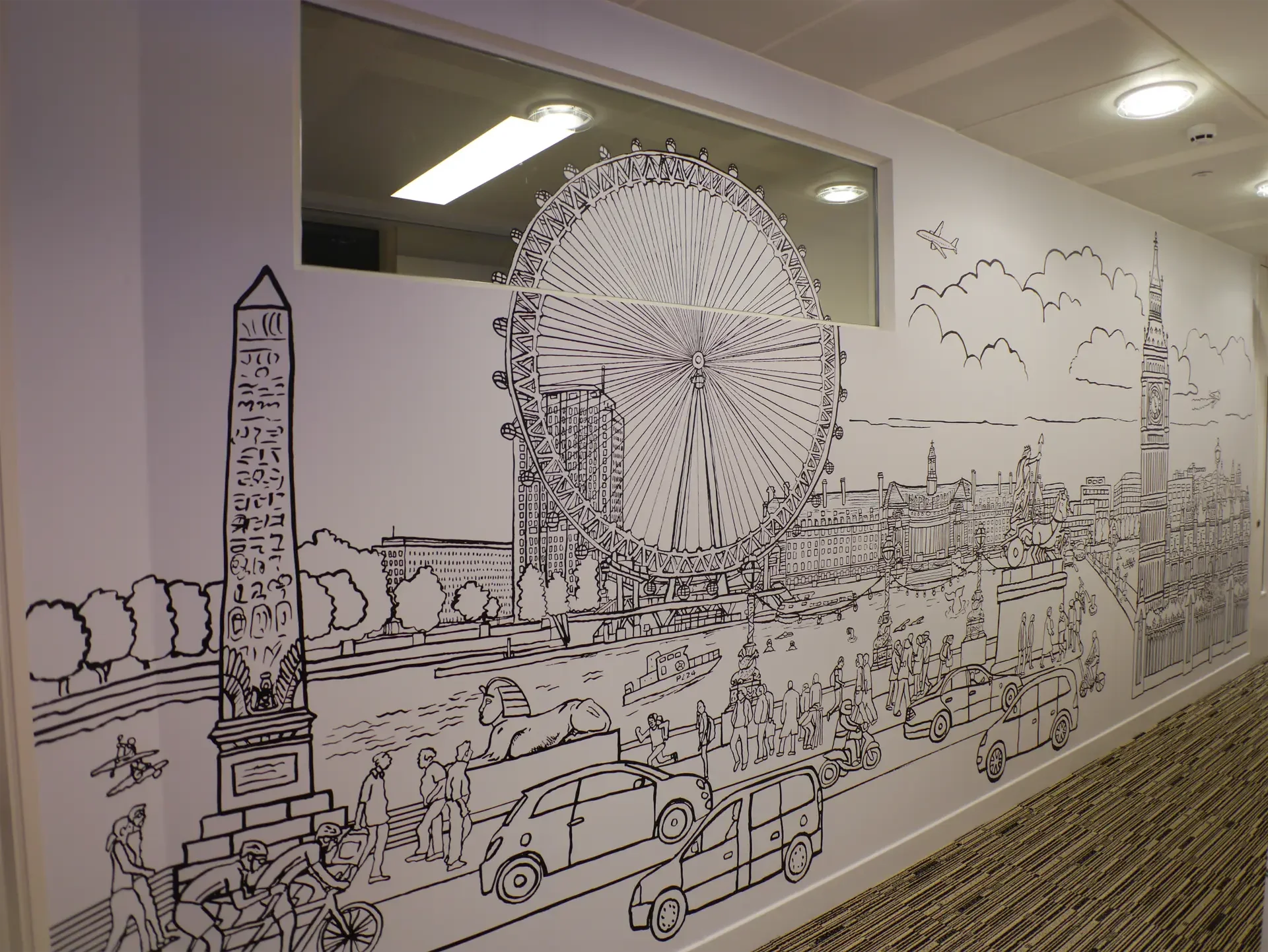 Wide perspective of the wall installation highlighting London landmarks like the London Eye and Cleopatra's Needle.