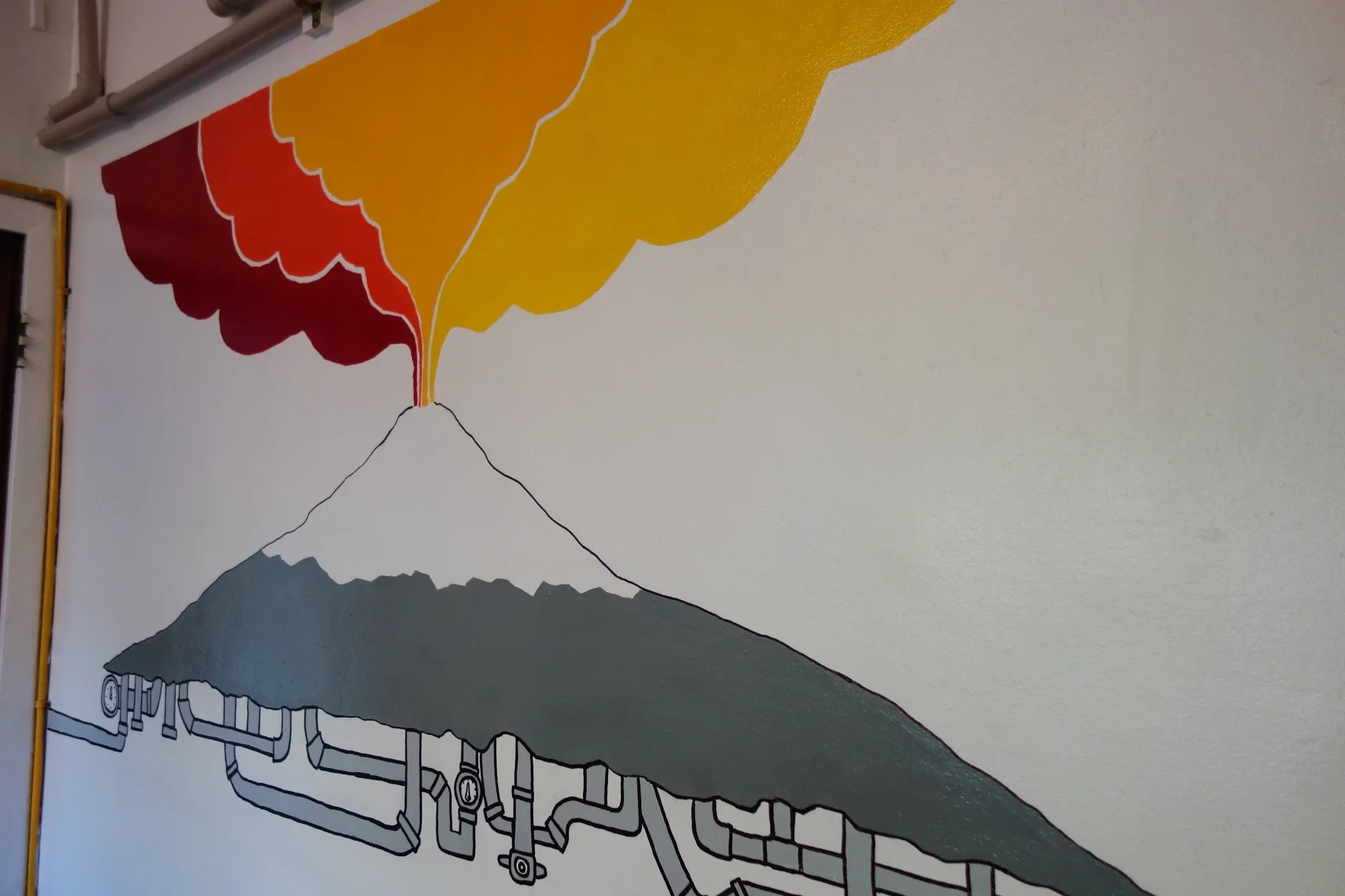 Kitchen wall mural featuring Villarrica Volcano at Chili Kiwi Hostel, Pucón, Chile.