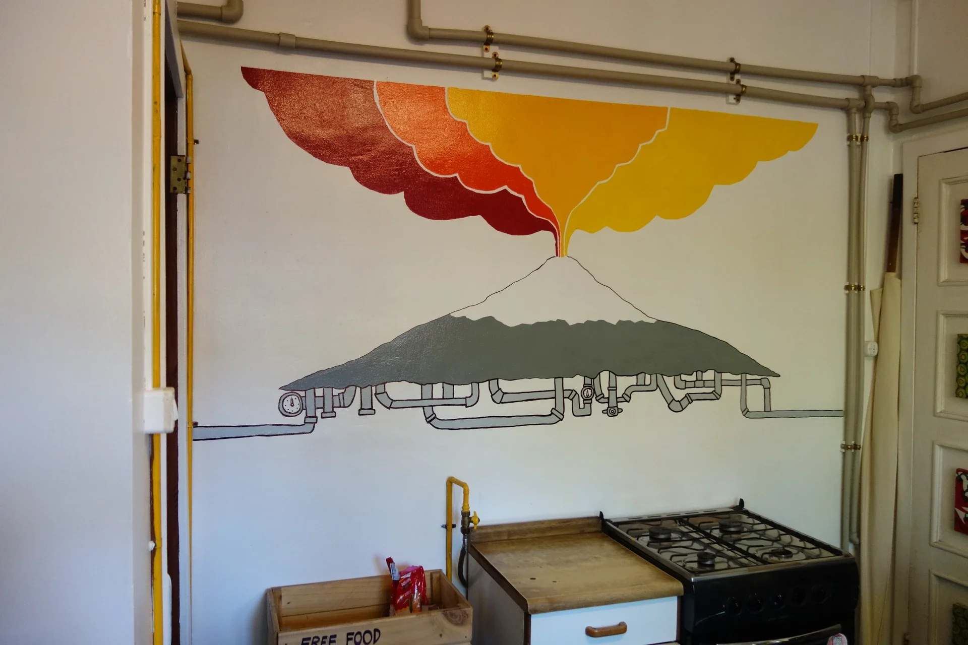Integration of existing kitchen pipework directly into the volcanic smoke illustration.