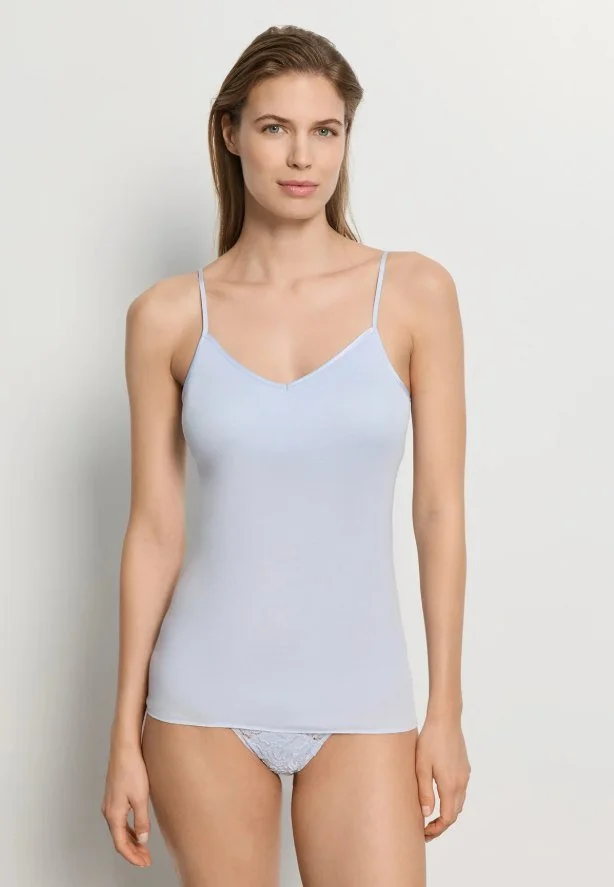 Model in a pale blue thin-strap V-neck camisole