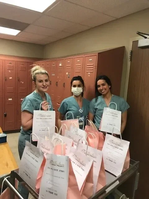 Nurses holding Comfort Project gift bags