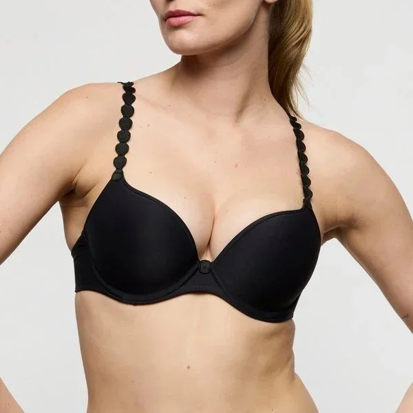 Close-up of a black heart-shaped molded bra with dot straps
