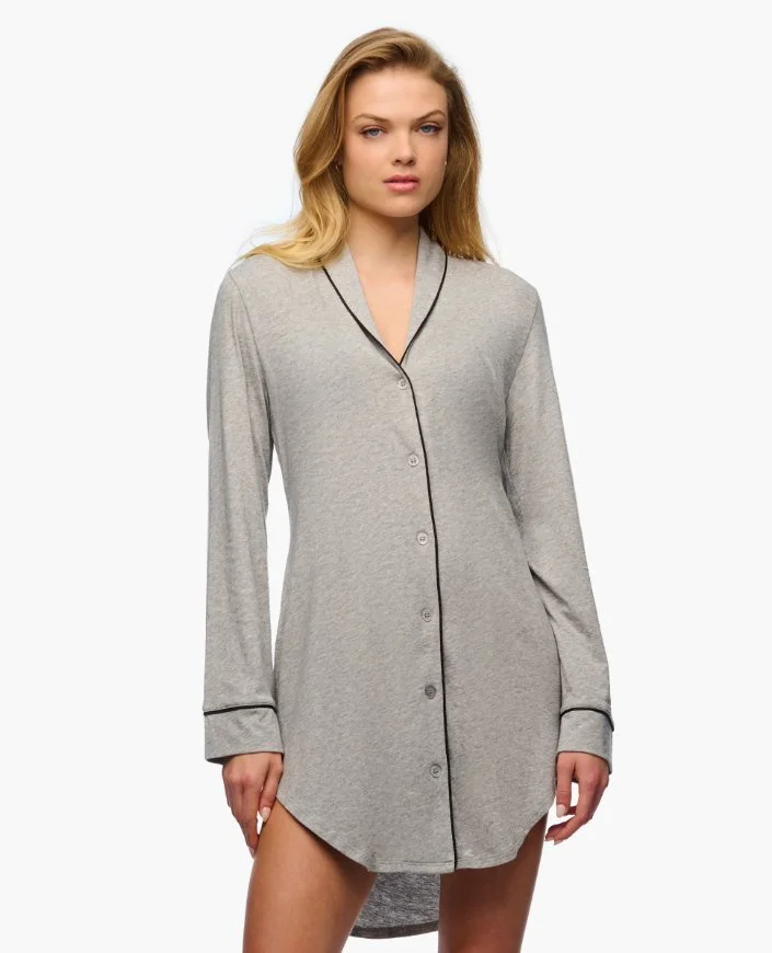 Model in a heather gray long-sleeve button-front nightshirt with black piping