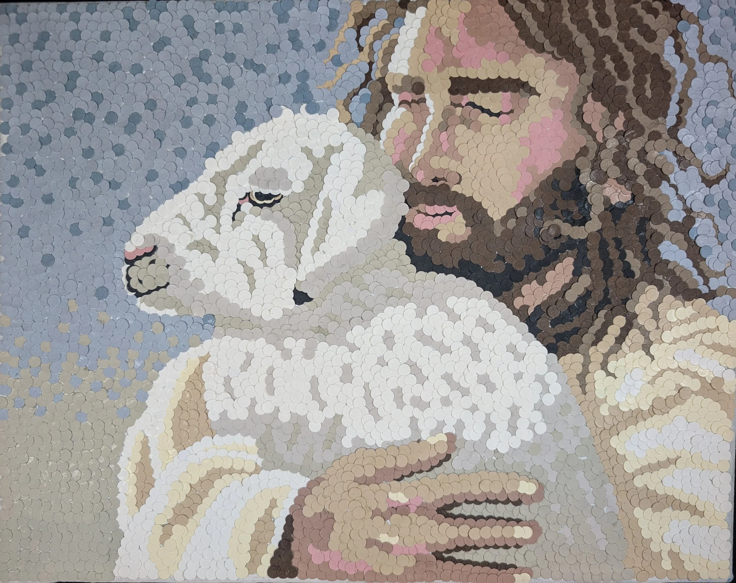 Penny mosaic sculpture of a woman holding a white cat.