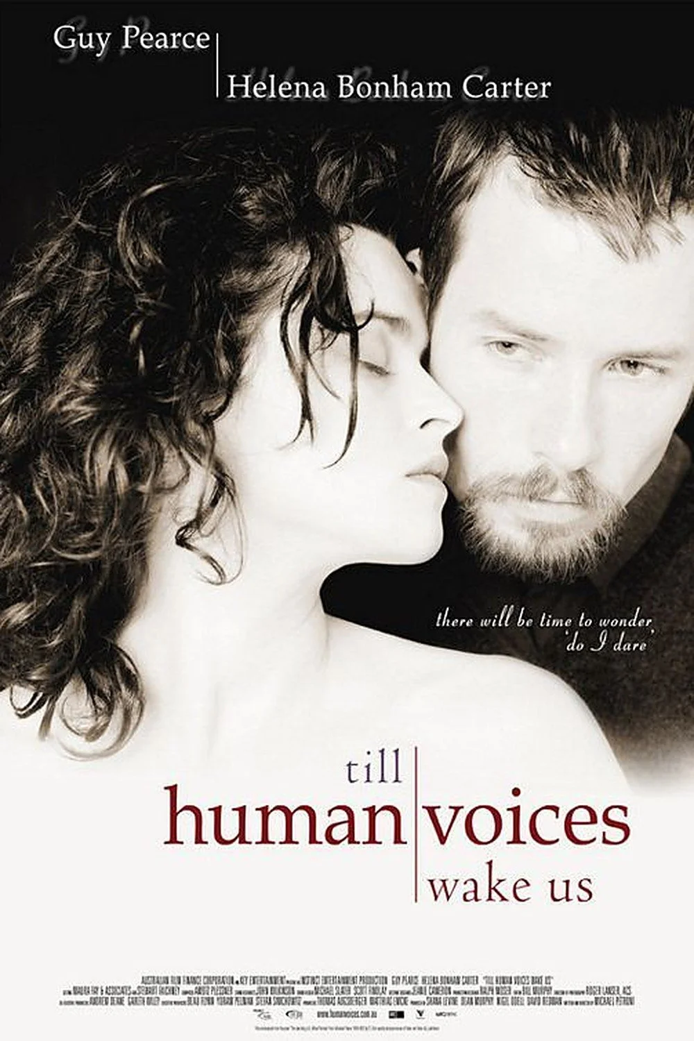 Movie poster for "Till Human Voices Wake Us" with the tagline 'there will be time to wonder, do I dare' and the names of the actors, Guy Pearce and Helena Bonham Carter.