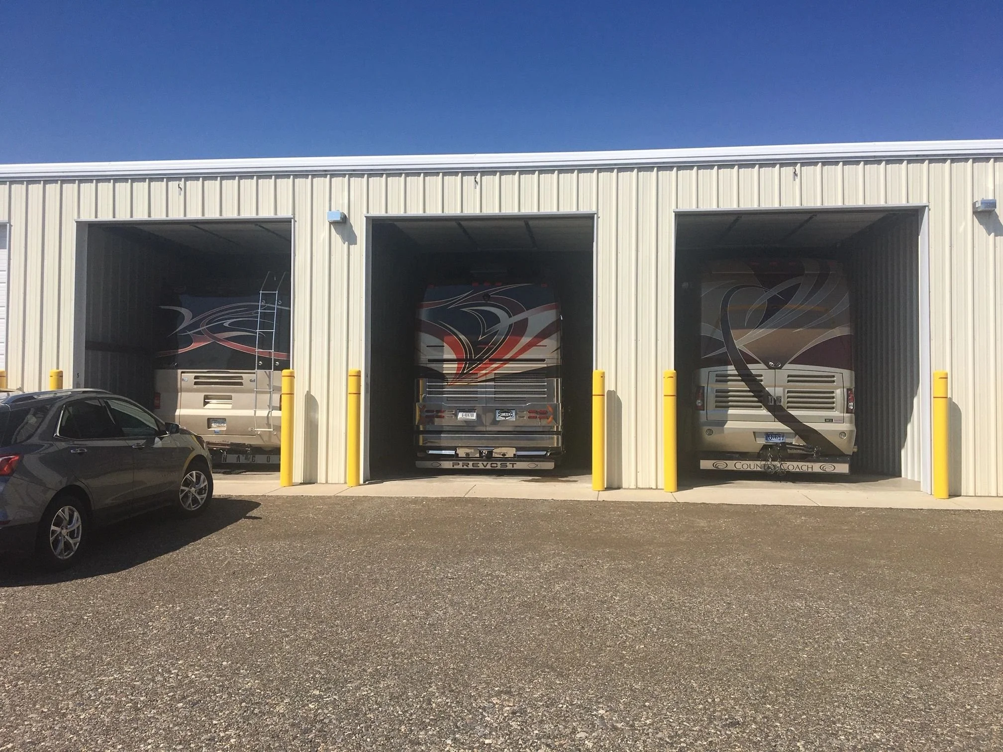 Motorhomes parked in indoor storage bays at Prime Storage, Manhattan MT