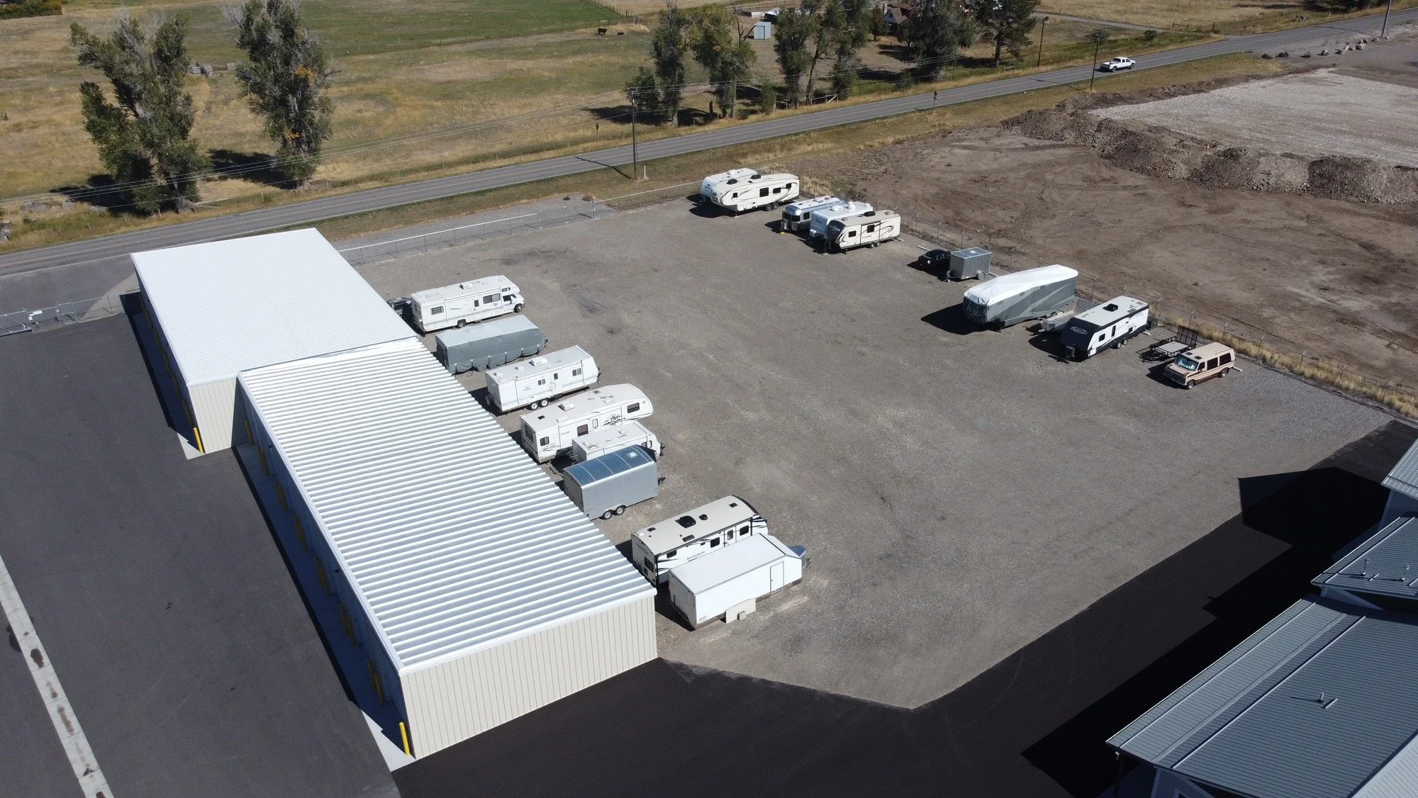 Fenced outdoor parking lot with RVs and trailers at Prime Storage, Manhattan MT