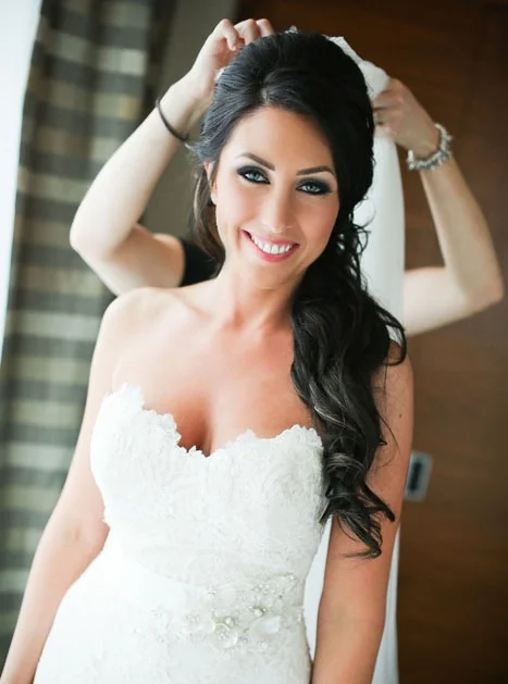 The veil is the finishing touch on Roxanne's beautiful wedding day look. Photo credit: Butter Studios