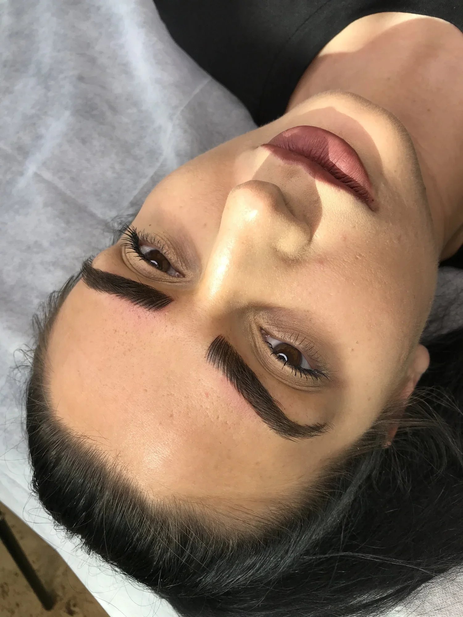 Close-up of brow and lip artistry from Brianna Errelat’s portfolio