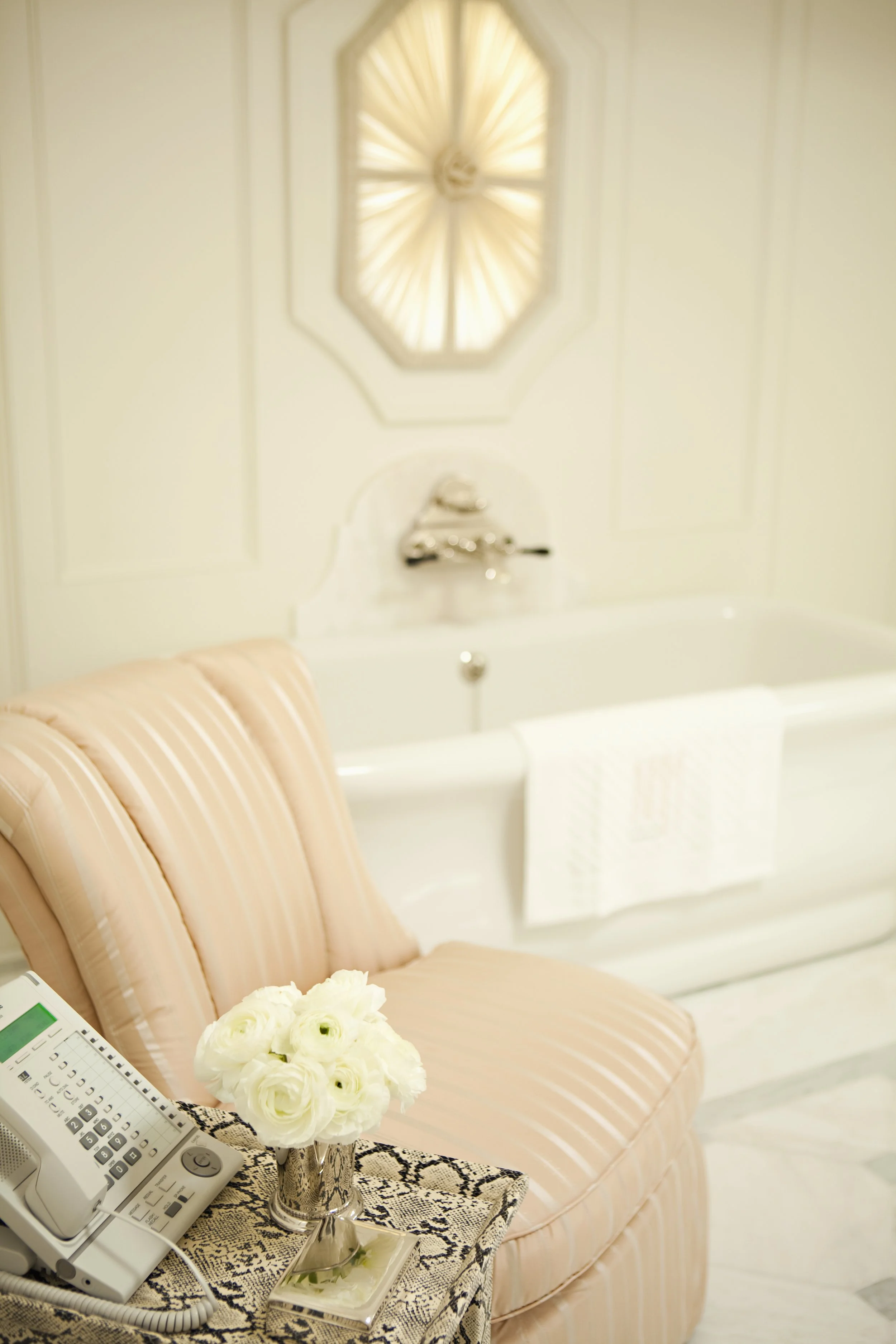 Tub filler and a peach leather armchair
