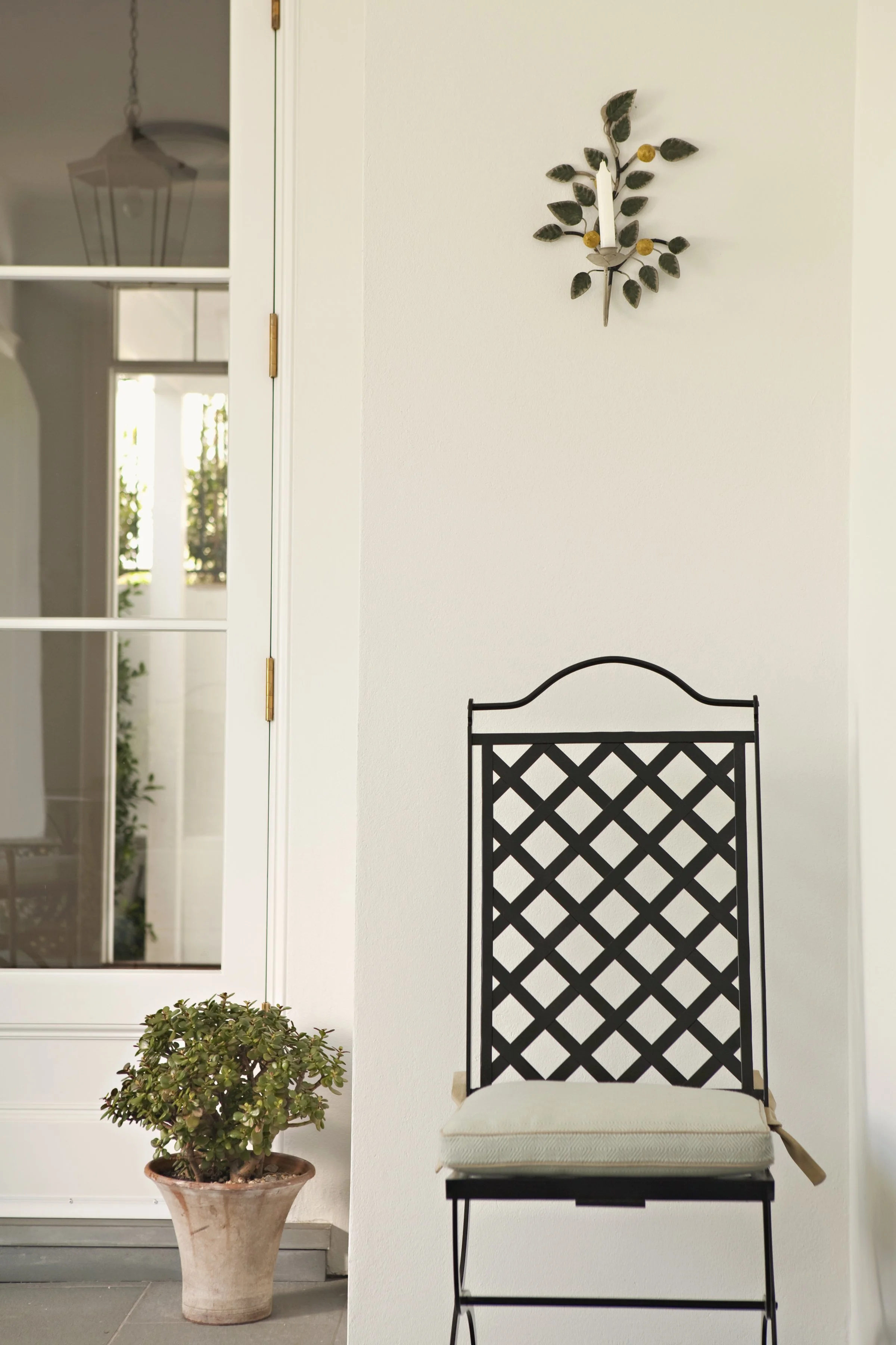 Ironwork lattice detail beside a window