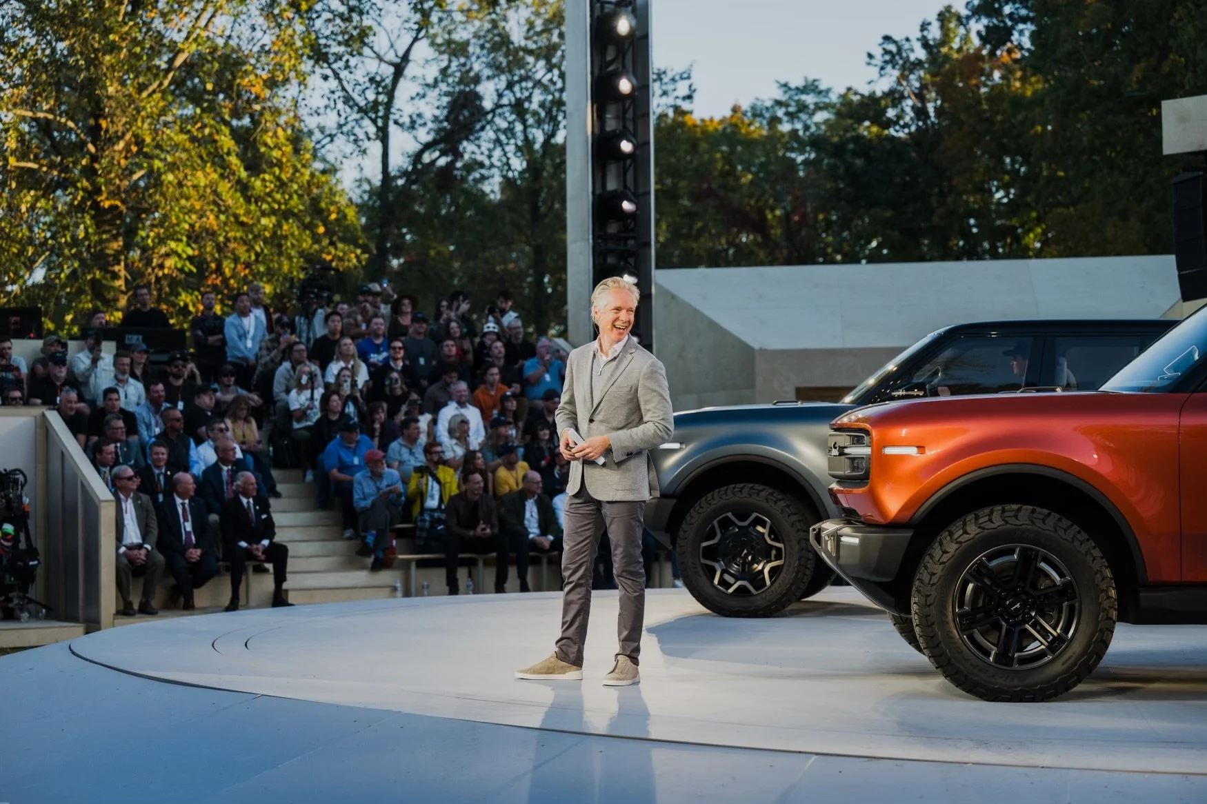 Scott Keogh, president and CEO of Scout Motors, wearing a grey pant, grey sweater, white shirt and grey sportcoat , styled by Jordan Jollon.